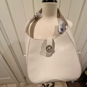 NWT Lululemon Leather Alternative
Shoulder Bag 8L Beige Cashew Silver
Hardware